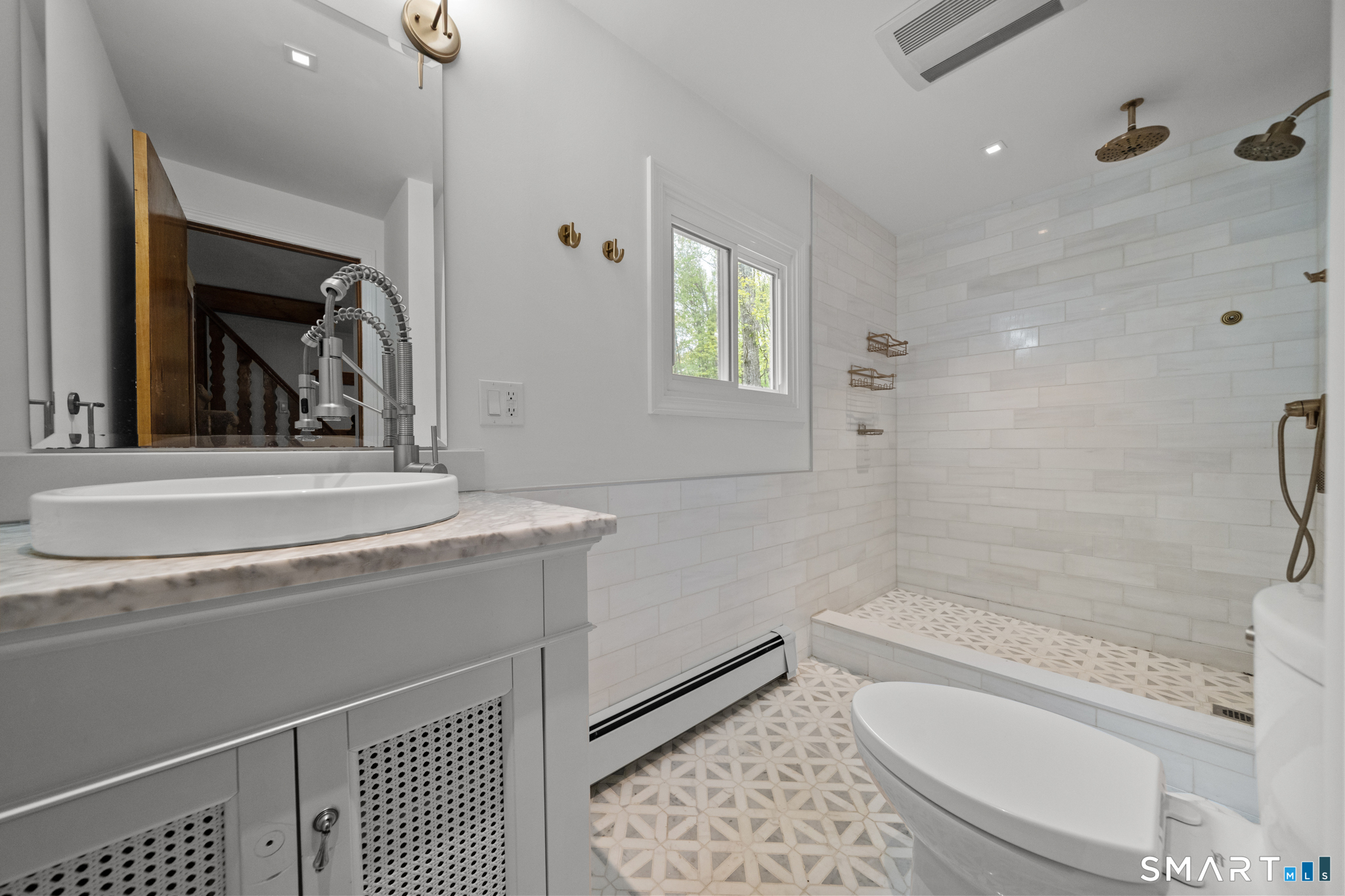 343 Hope Furnace Road Hope, RI 02831 - Photo 8 of 35 a bathroom with a granite countertop sink a toilet and shower