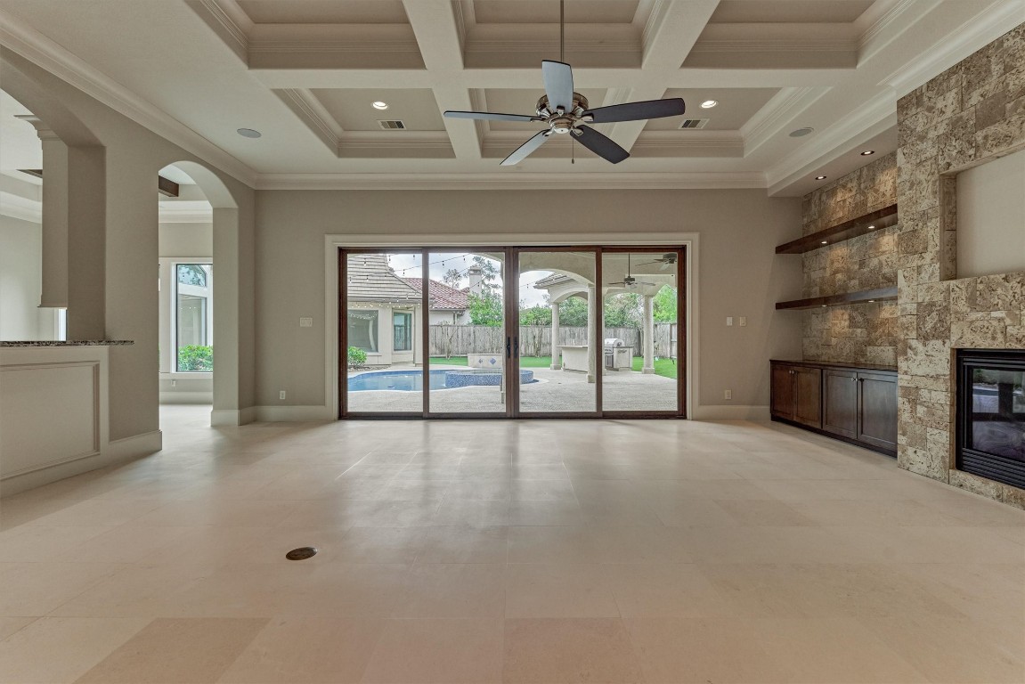25 Post Shadow Estate Drive Spring, TX 77389 - Photo 18 of 50 a view of an empty room with a fireplace and a window