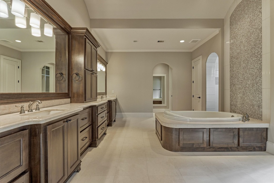 25 Post Shadow Estate Drive Spring, TX 77389 - Photo 23 of 50 a spacious bathroom with a double vanity sink and a mirror