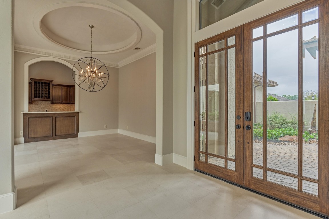 25 Post Shadow Estate Drive Spring, TX 77389 - Photo 8 of 50 a view of a livingroom with a fireplace a ceiling fan and front door