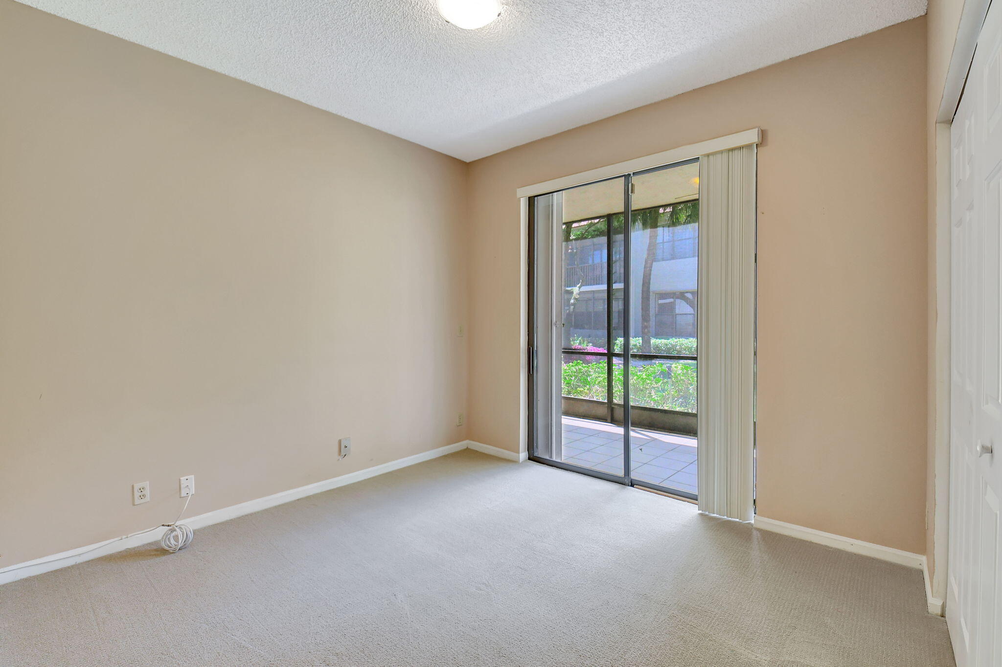 5770 Coach House Circle, Unit D Boca Raton, FL 33486 - Photo 36 of 52 GUEST BEDROOM WITH PATIO ACCESS