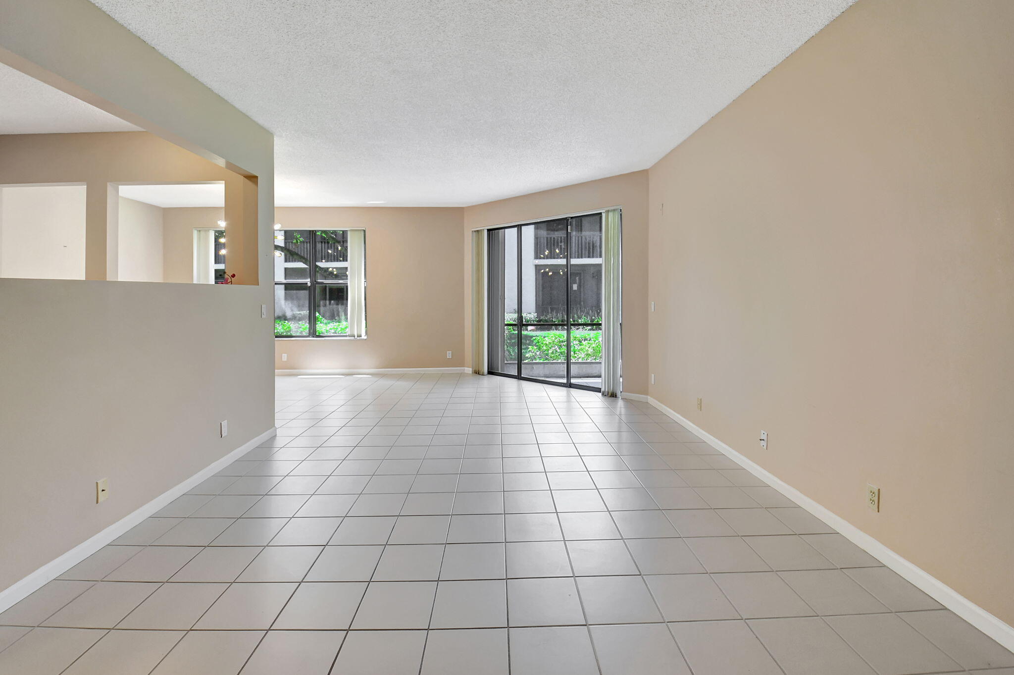 5770 Coach House Circle, Unit D Boca Raton, FL 33486 - Photo 10 of 52 FORMAL LIVING ROOM LEADS TO PATIO