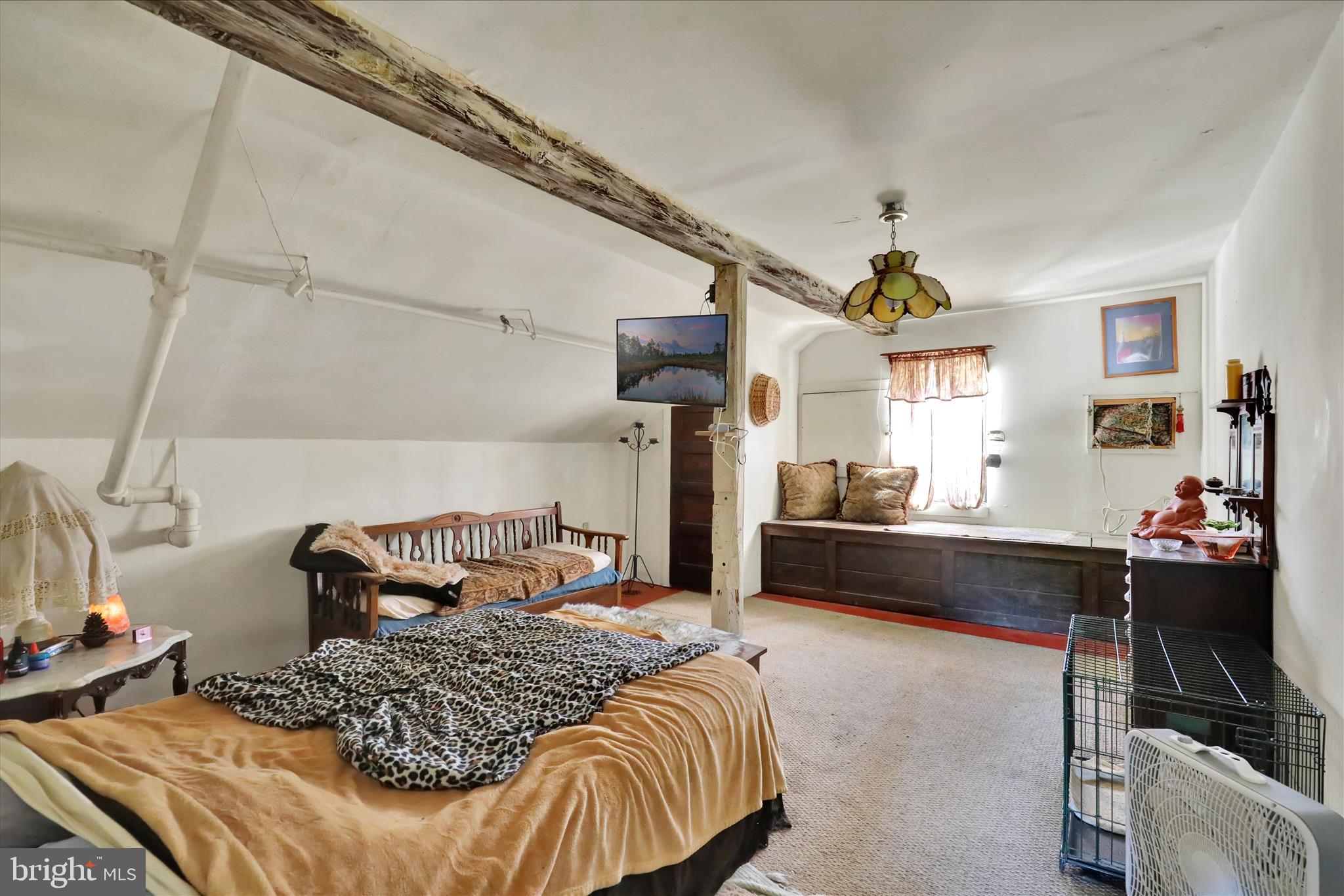 1524 Friedensburg Road Reading, PA 19606 - Photo 29 of 57 a bedroom with a bed and a chandelier