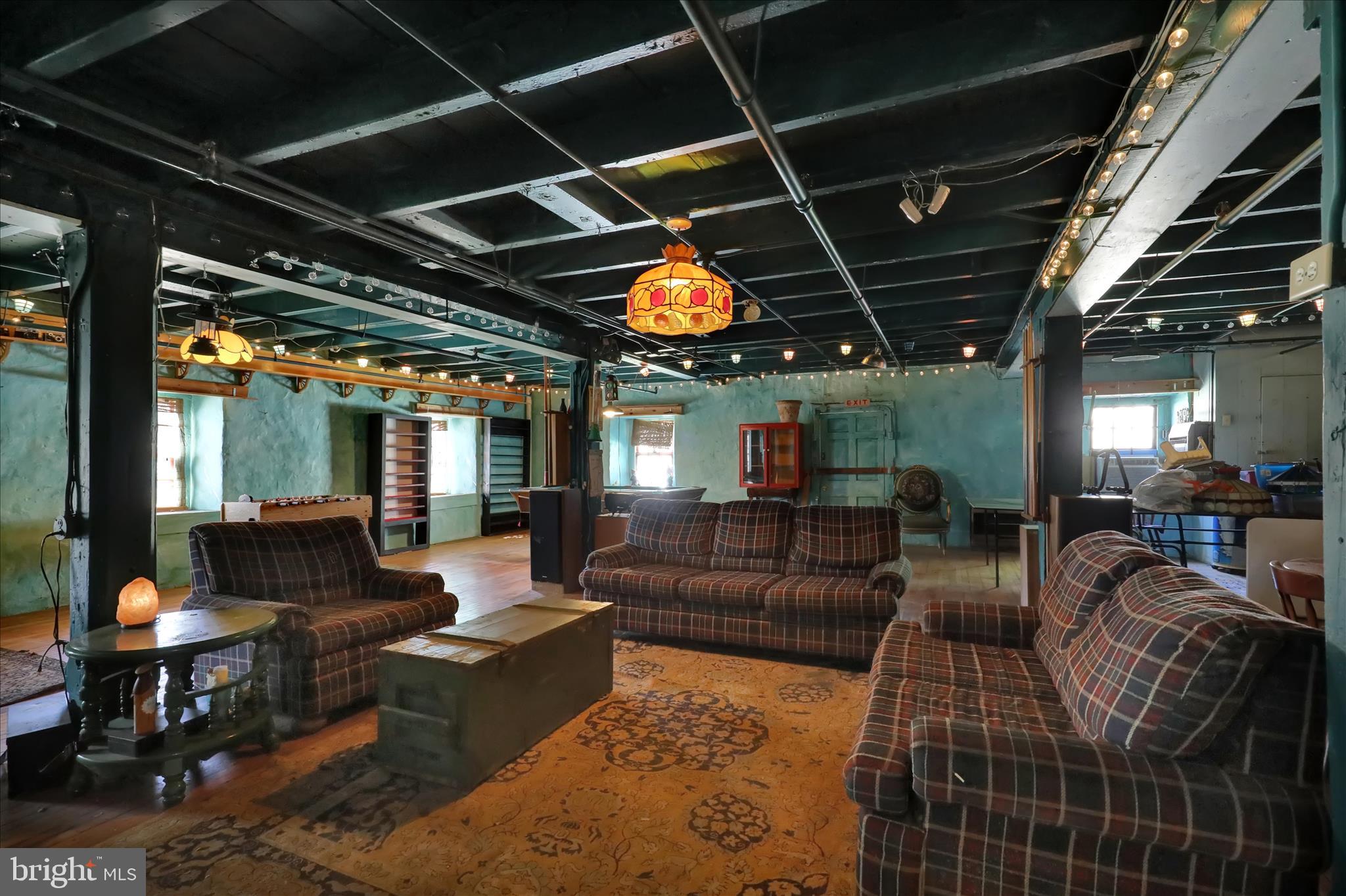 1524 Friedensburg Road Reading, PA 19606 - Photo 36 of 57 a media room with lots of chairs and a chandelier
