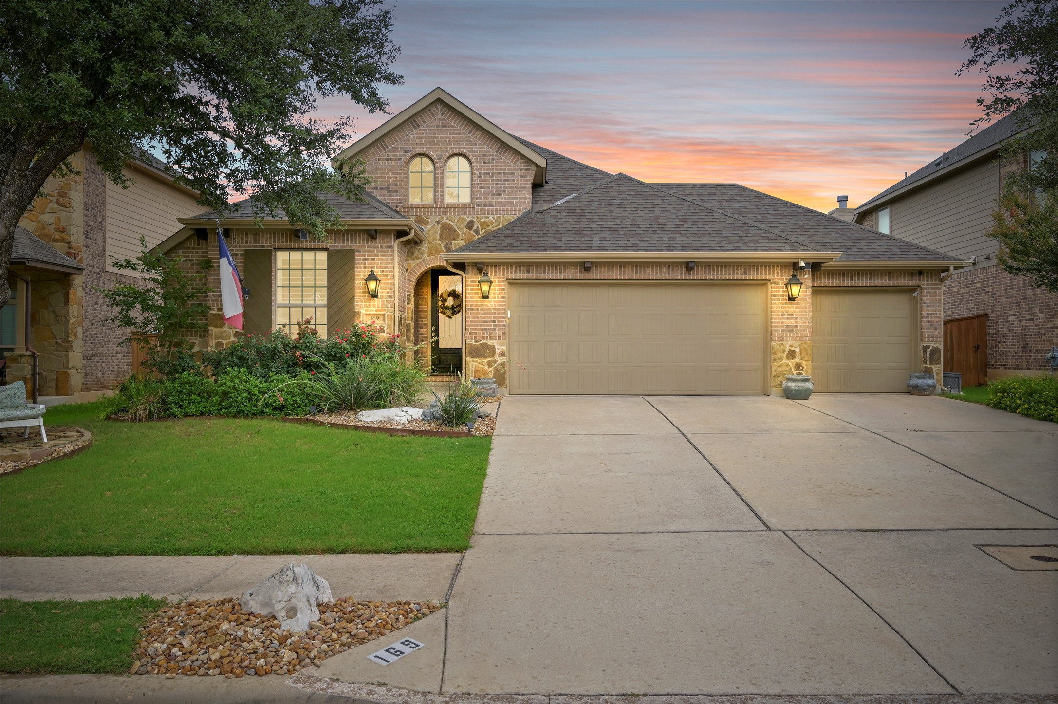 a front view of a house with garden