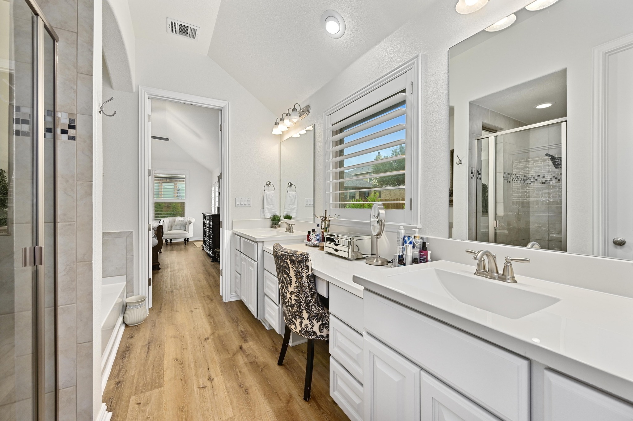 169 Fort Cobb Way Georgetown, TX 78628 - Photo 16 of 28 a en suite bathroom with sink and mirror