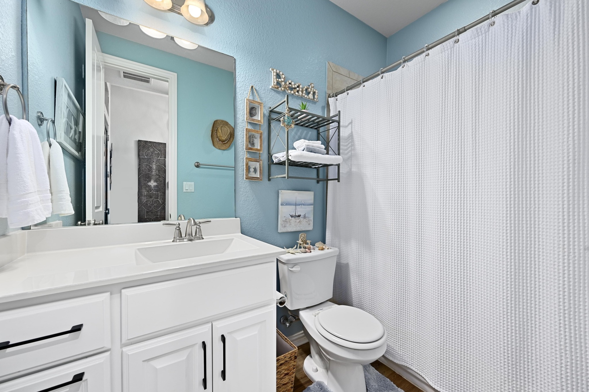 169 Fort Cobb Way Georgetown, TX 78628 - Photo 19 of 28 a bathroom with a sink a toilet and mirror
