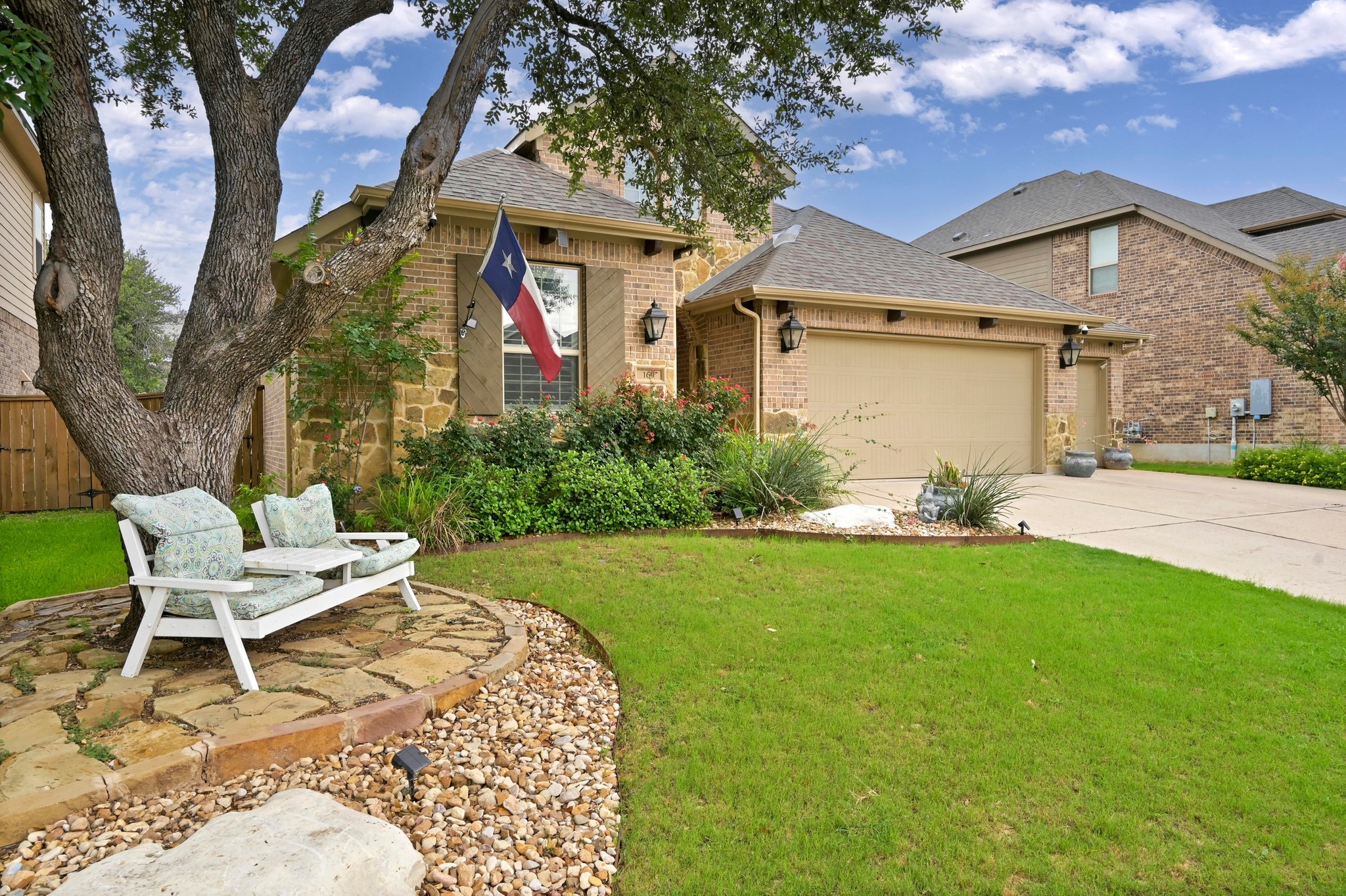 169 Fort Cobb Way Georgetown, TX 78628 - Photo 2 of 28 a front view of a house with garden