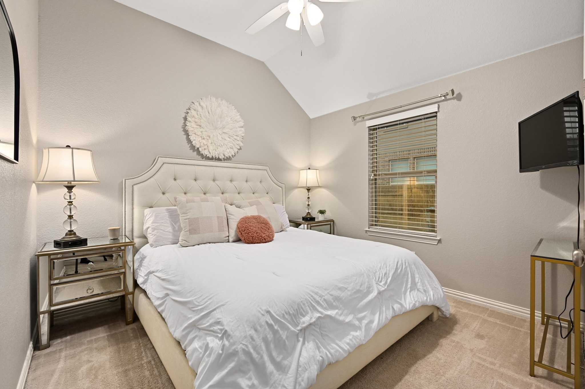 169 Fort Cobb Way Georgetown, TX 78628 - Photo 22 of 28 a bedroom with a bed and a tv on the dresser