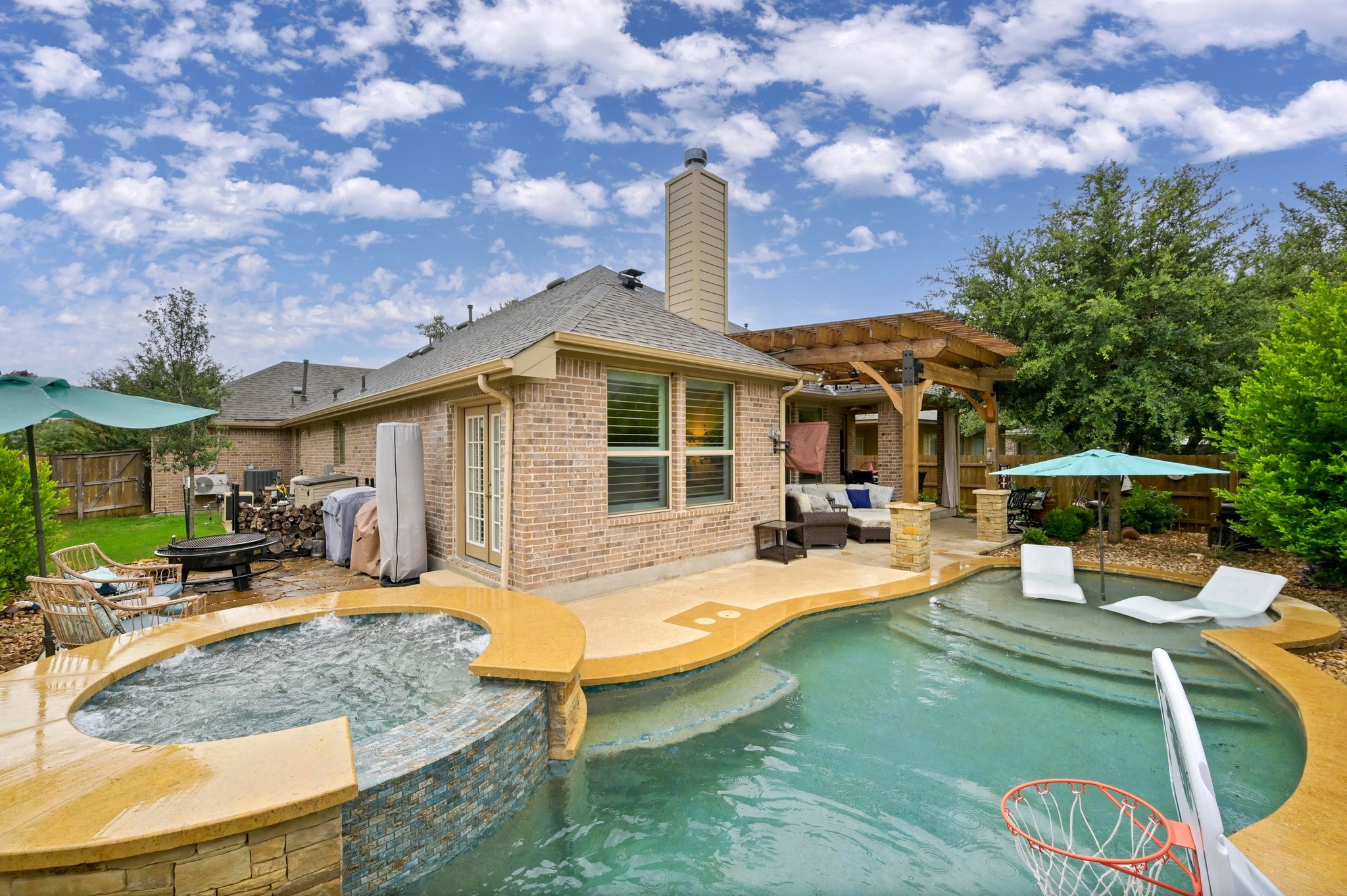 169 Fort Cobb Way Georgetown, TX 78628 - Photo 24 of 28 a view of a house with swimming pool and sitting area