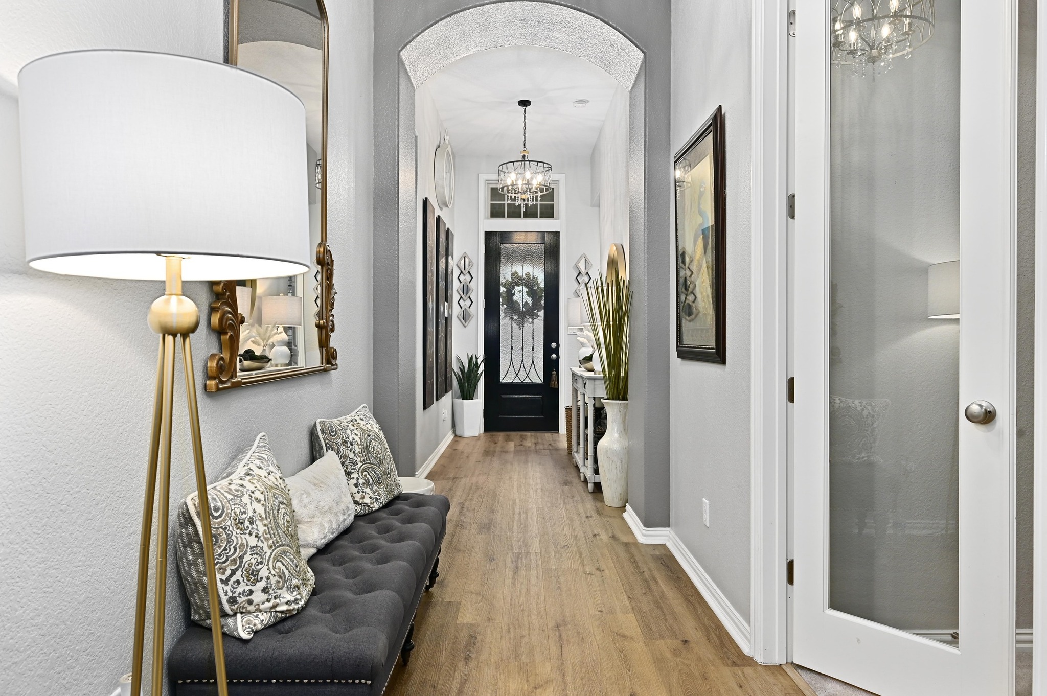 169 Fort Cobb Way Georgetown, TX 78628 - Photo 4 of 28 a hallway with furniture and a wooden floor