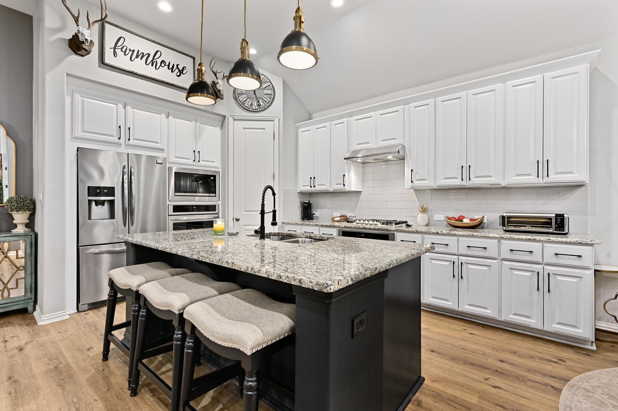 169 Fort Cobb Way Georgetown, TX 78628 - Photo 6 of 28 a kitchen with stainless steel appliances granite countertop a sink a stove and cabinets