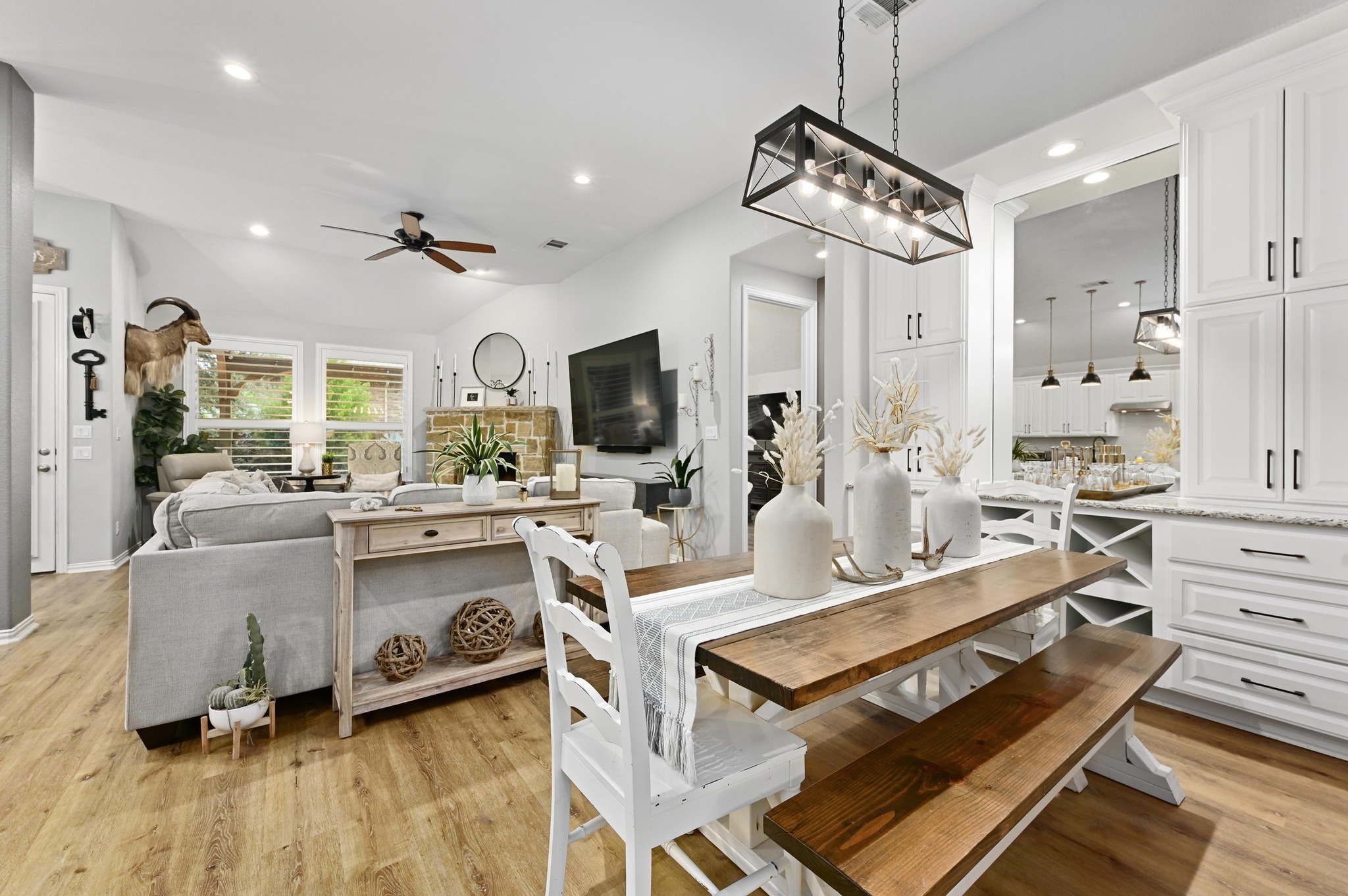 169 Fort Cobb Way Georgetown, TX 78628 - Photo 9 of 28 a living room with stainless steel appliances kitchen island granite countertop furniture and a view of kitchen