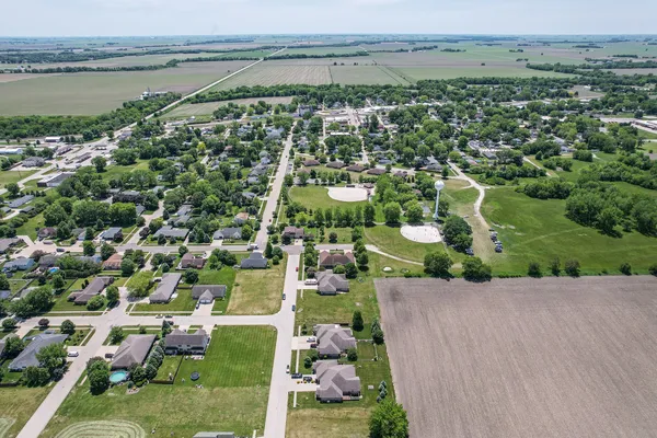 an aerial view of a house with a lake view