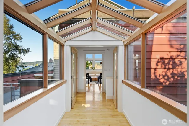 a view of a living room and a balcony