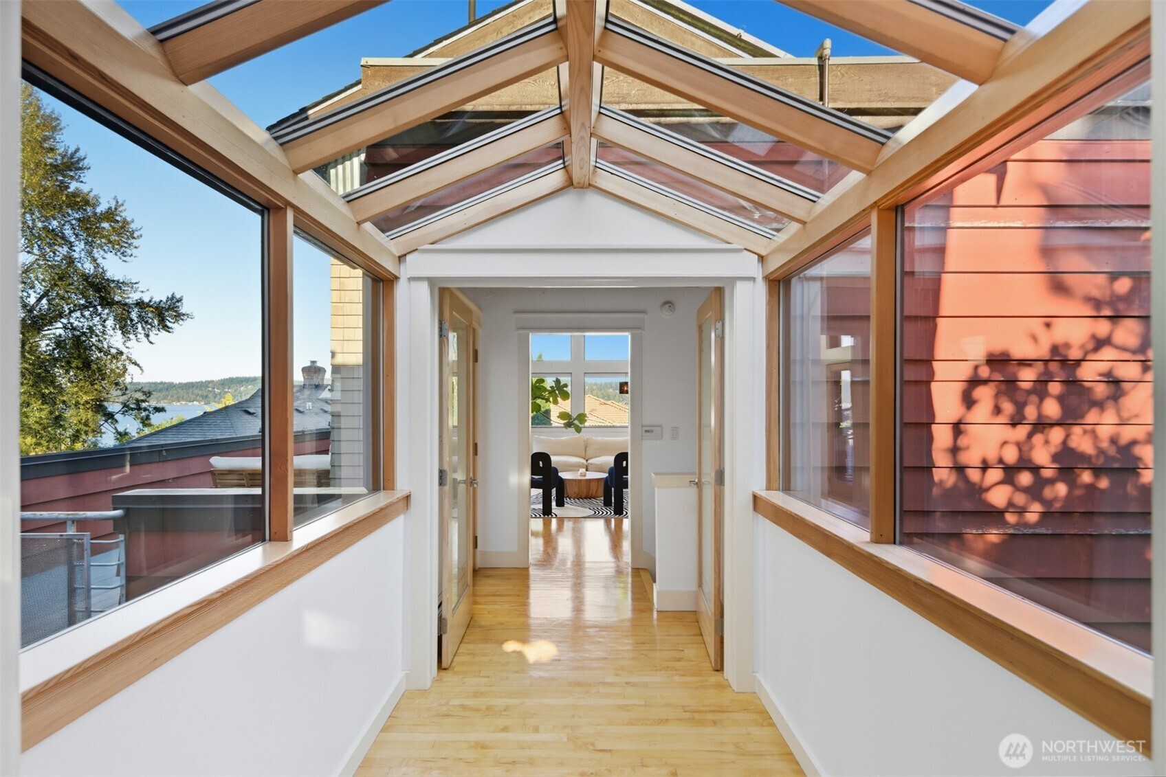 8770 Sand Point Way Northeast Seattle, WA 98115 - Photo 1 of 40 a view of a living room and a balcony