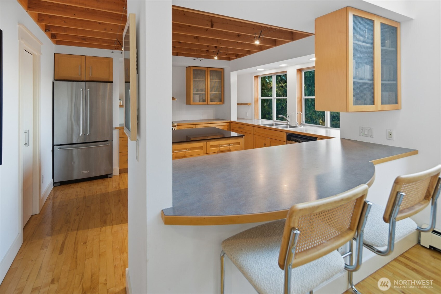 8770 Sand Point Way Northeast Seattle, WA 98115 - Photo 12 of 40 a view of a dining room with furniture and floor to ceiling window