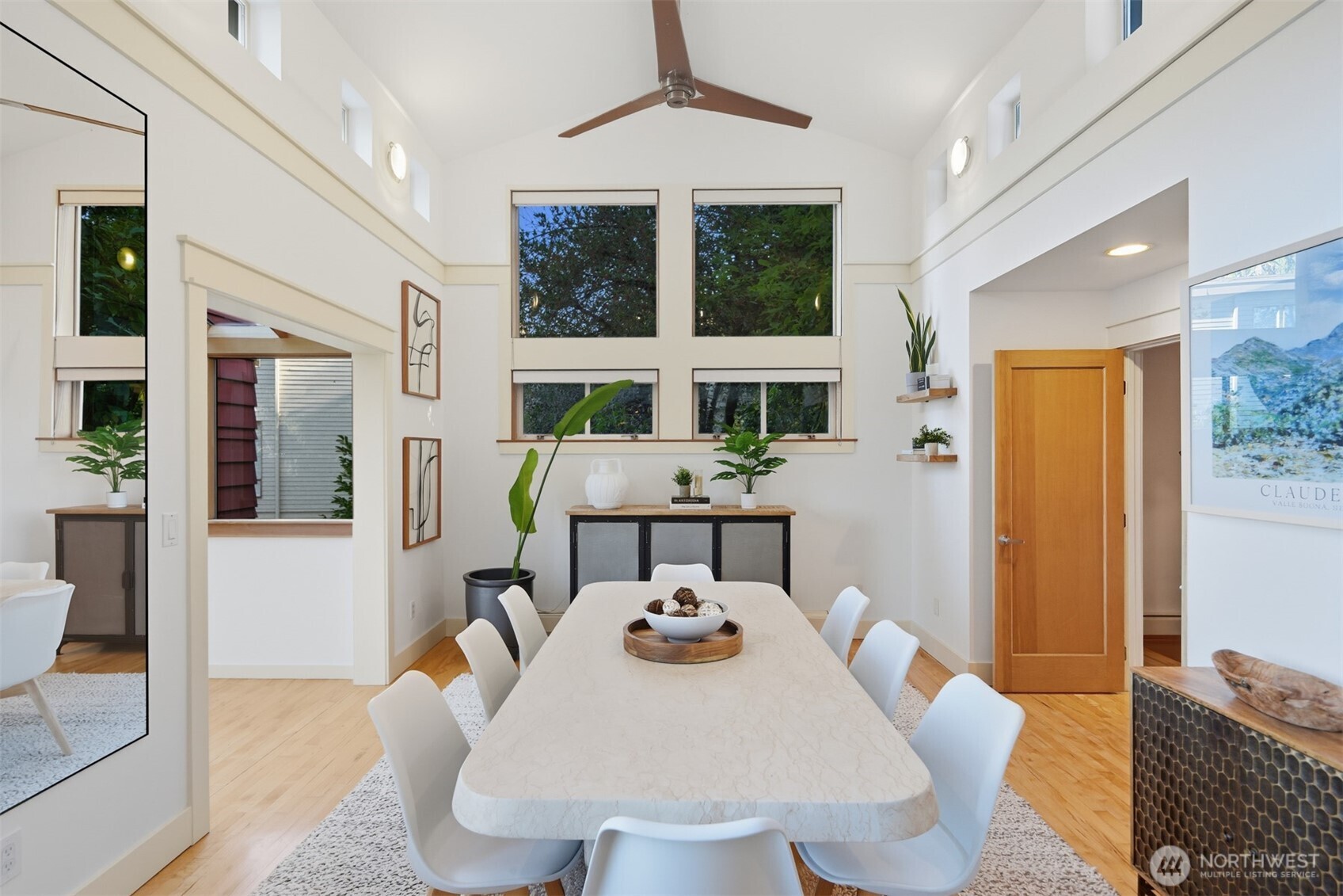 8770 Sand Point Way Northeast Seattle, WA 98115 - Photo 15 of 40 a view of a dining room with furniture window and wooden floor