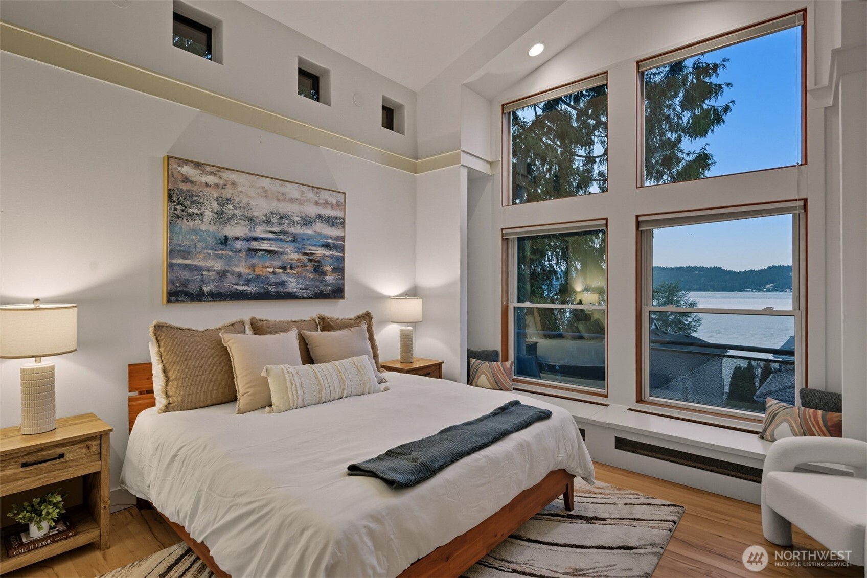 8770 Sand Point Way Northeast Seattle, WA 98115 - Photo 16 of 40 a bedroom with furniture and a large window