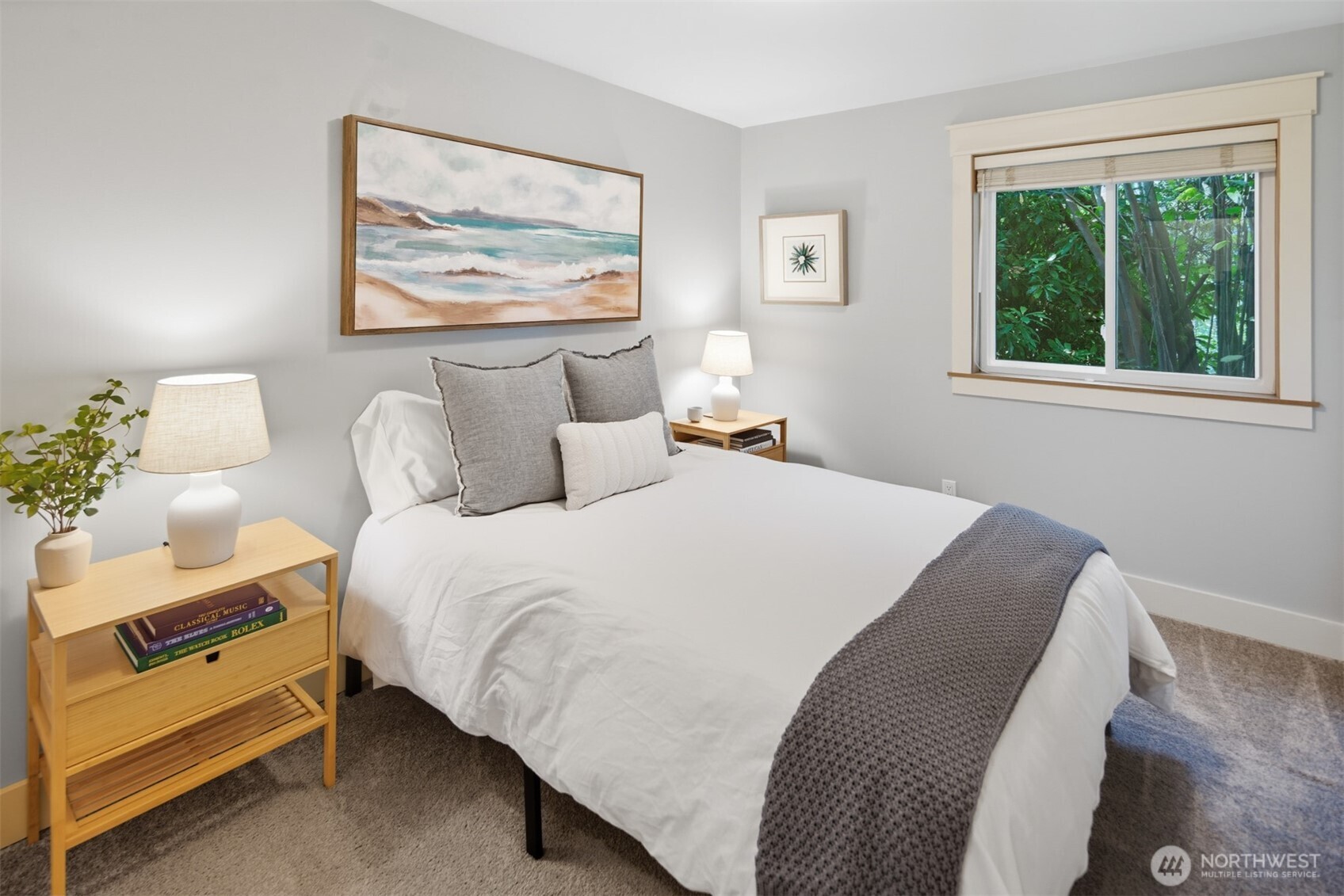 8770 Sand Point Way Northeast Seattle, WA 98115 - Photo 26 of 40 a bedroom with bed and a painting on the wall