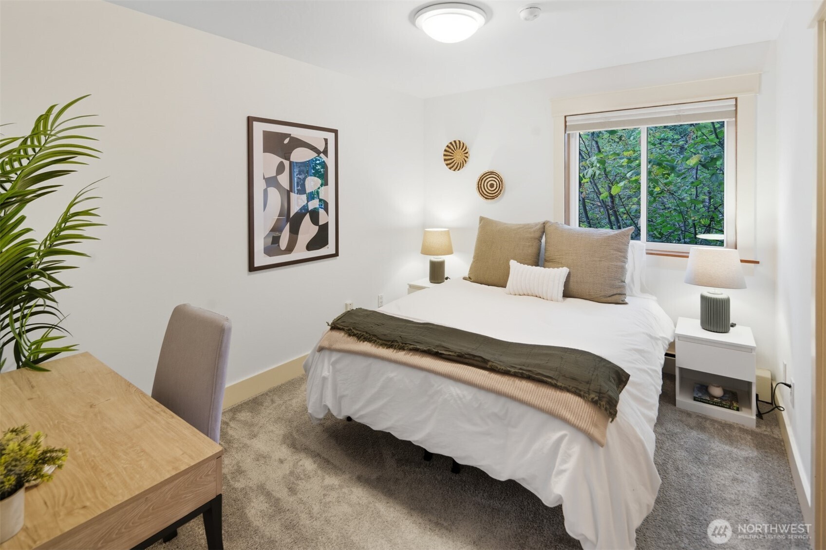 8770 Sand Point Way Northeast Seattle, WA 98115 - Photo 33 of 40 a bedroom with furniture and a large window