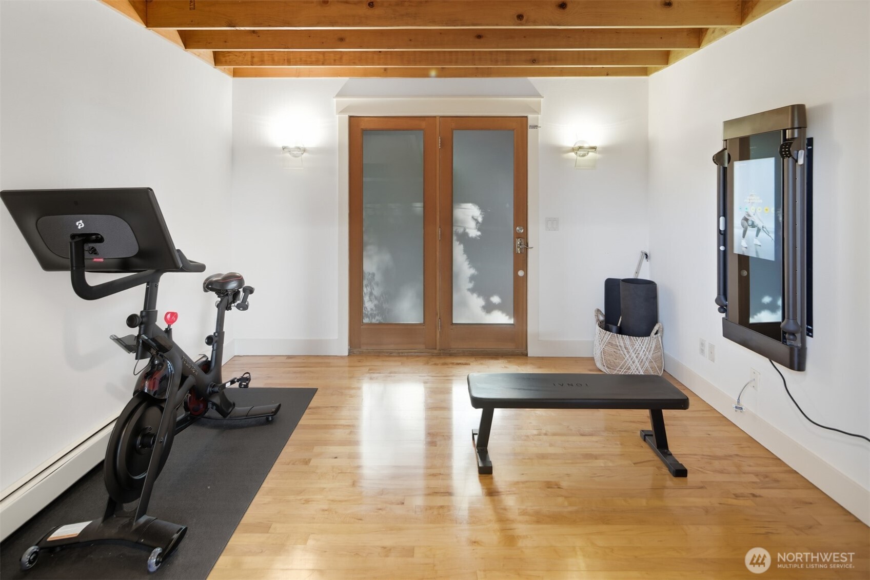 8770 Sand Point Way Northeast Seattle, WA 98115 - Photo 34 of 40 a room with gym equipment and view of living room