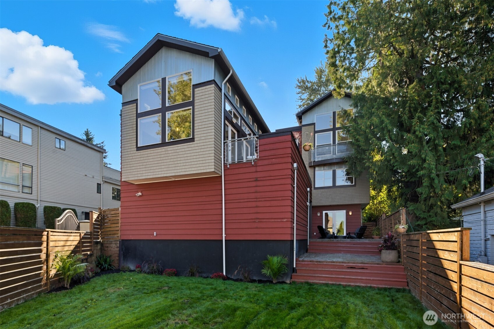 8770 Sand Point Way Northeast Seattle, WA 98115 - Photo 8 of 40 a front view of a house with garden