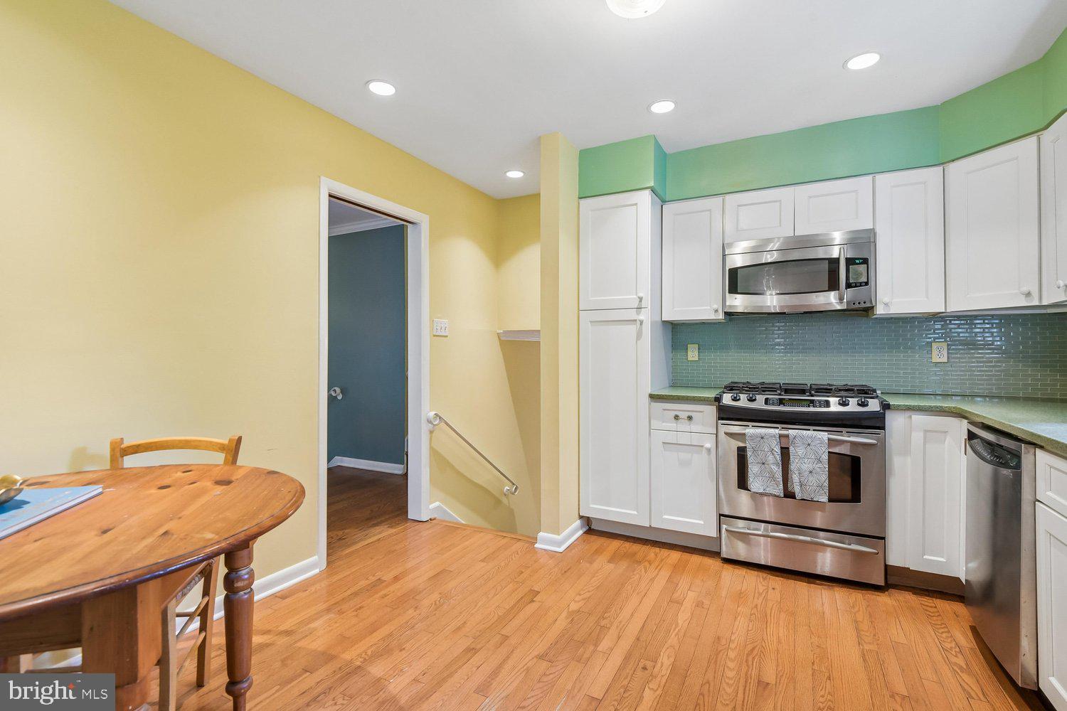 1518 Winchester Road Annapolis, MD 21409 - Photo 19 of 70 a kitchen with stainless steel appliances granite countertop a stove a refrigerator and a microwave