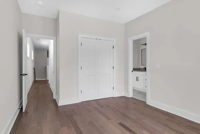 wooden floor with white walls