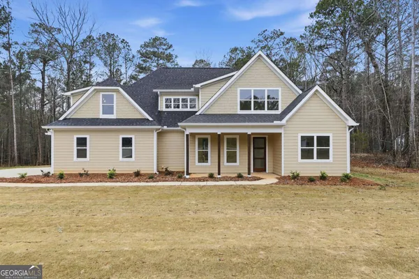 a front view of a house with a yard