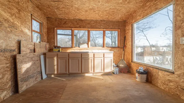 a open kitchen with a sink stove and cabinets