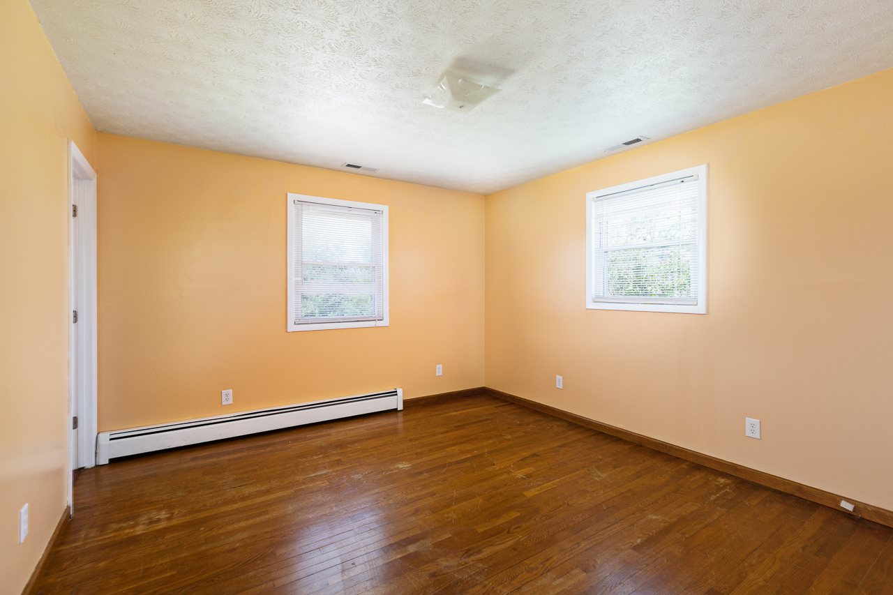 3760 Rockfish Road Grottoes, VA 24441 - Photo 11 of 34 a view of an empty room with wooden floor and a window