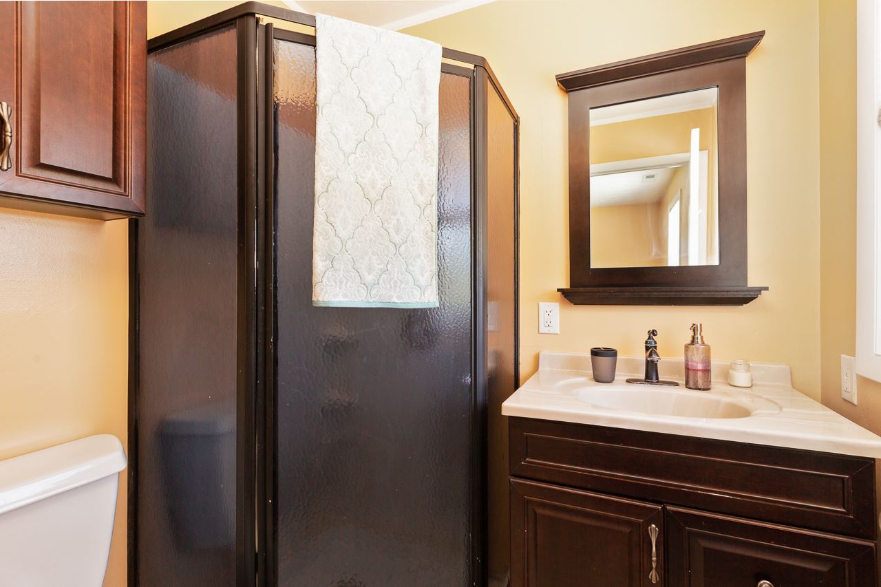 3760 Rockfish Road Grottoes, VA 24441 - Photo 12 of 34 a bathroom with a sink a vanity and a mirror