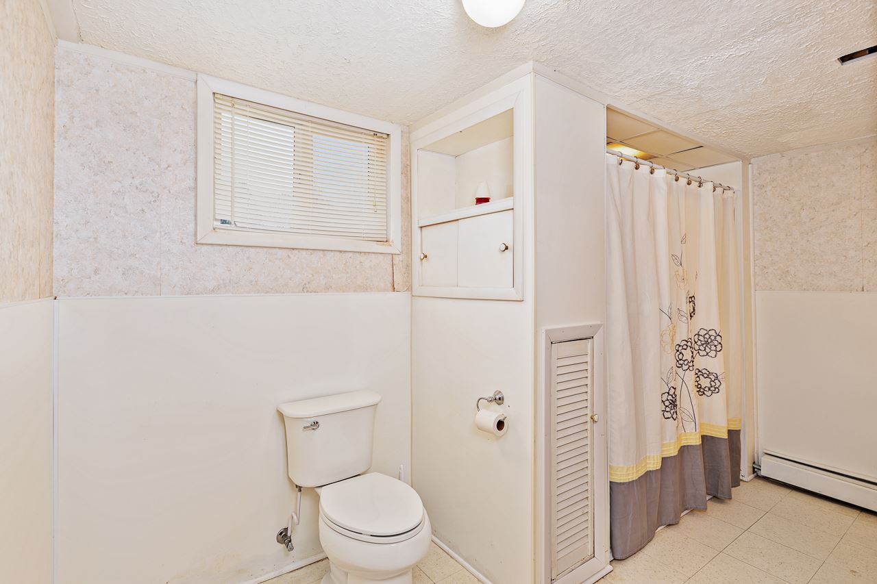 3760 Rockfish Road Grottoes, VA 24441 - Photo 19 of 34 a white toilet sitting next to a bathroom sink