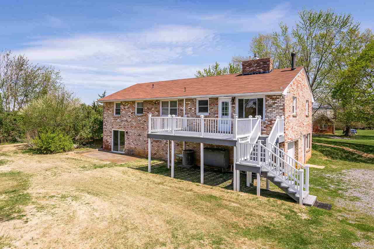 3760 Rockfish Road Grottoes, VA 24441 - Photo 26 of 34 a front view of a house with a yard table and chairs