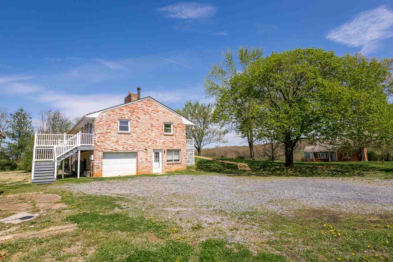 3760 Rockfish Road Grottoes, VA 24441 - Photo 27 of 34 a view of a house next to a big yard and large trees