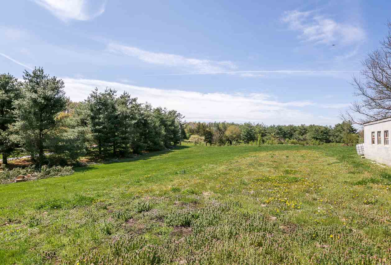 3760 Rockfish Road Grottoes, VA 24441 - Photo 33 of 34 a view of a field with an trees in the background