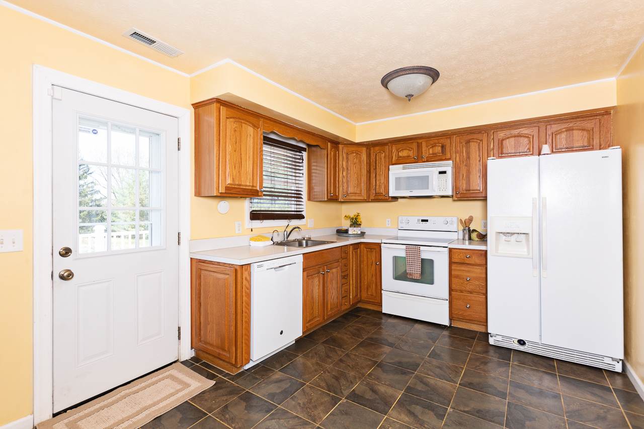3760 Rockfish Road Grottoes, VA 24441 - Photo 4 of 34 a kitchen with stainless steel appliances a refrigerator sink and cabinets