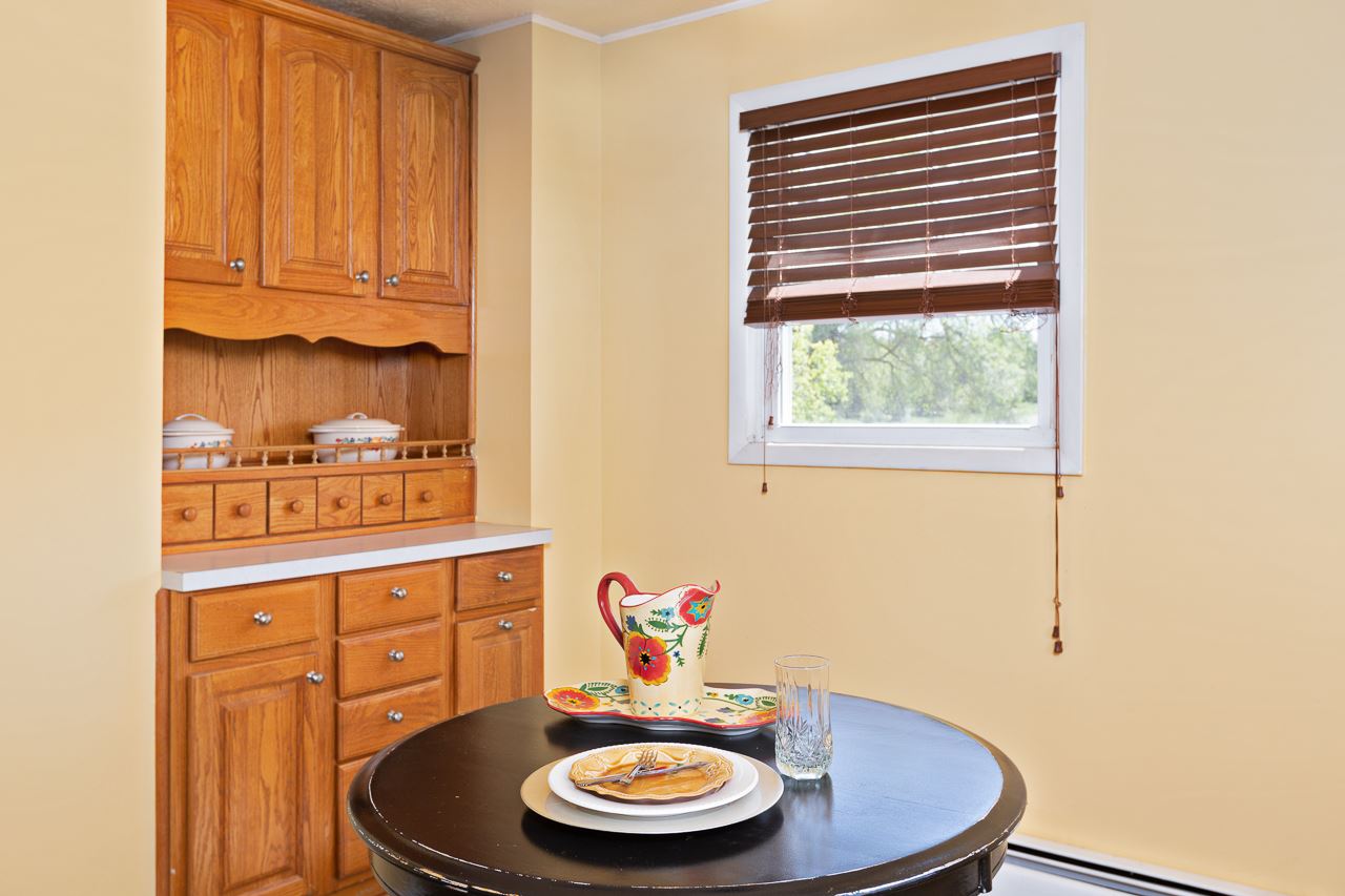 3760 Rockfish Road Grottoes, VA 24441 - Photo 7 of 34 a table with a sink and a stove with wooden floor