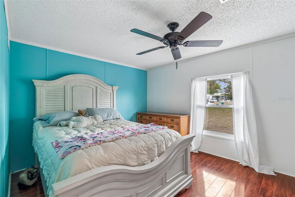 14242 Action Street Brooksville, FL 34613 - Photo 20 of 60 a bedroom with a bed and a window