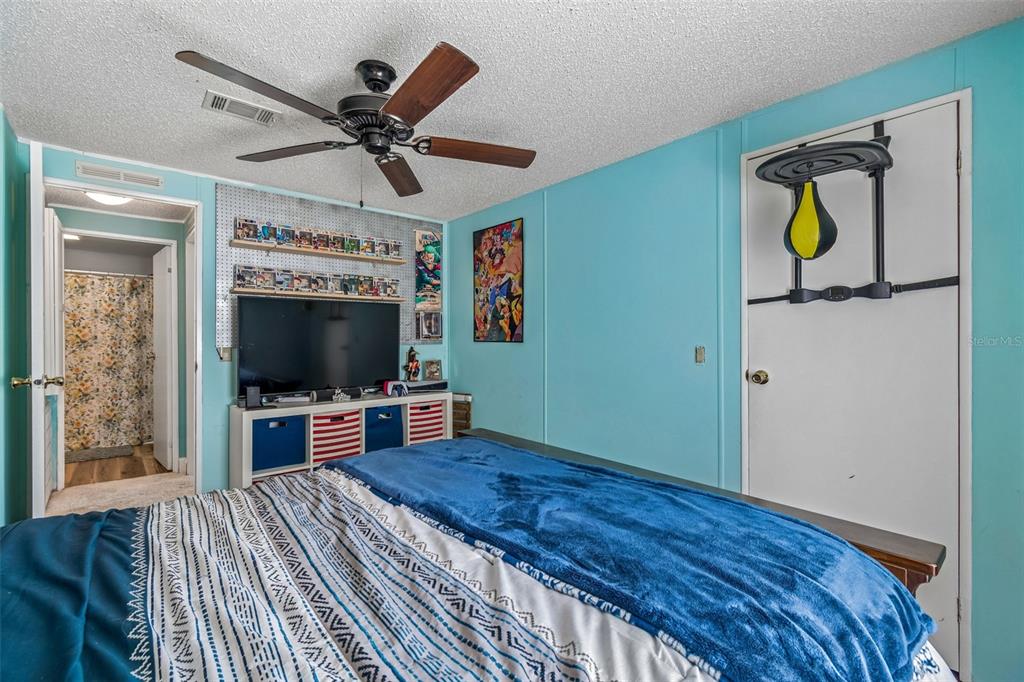14242 Action Street Brooksville, FL 34613 - Photo 23 of 60 a living room with furniture and a flat screen tv