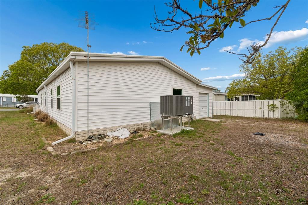 14242 Action Street Brooksville, FL 34613 - Photo 32 of 60 a view of a house with a yard