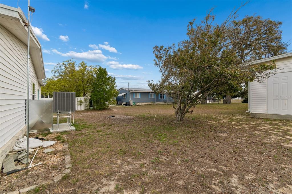 14242 Action Street Brooksville, FL 34613 - Photo 33 of 60 a view of a house with a yard