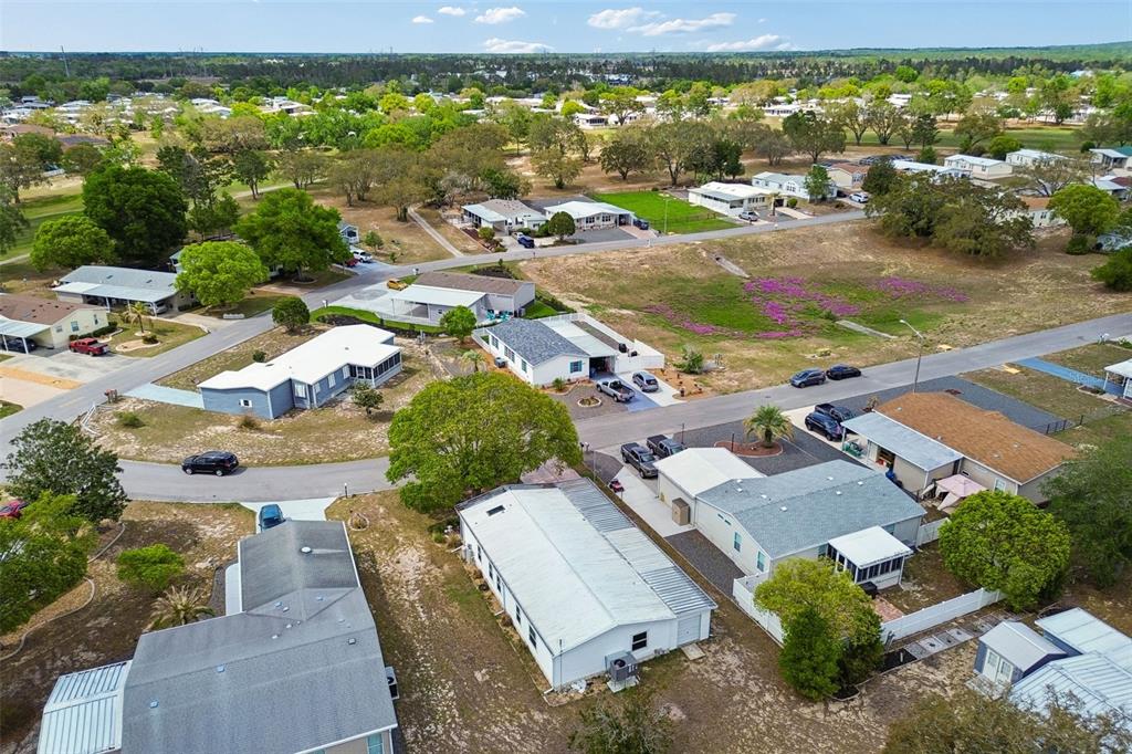14242 Action Street Brooksville, FL 34613 - Photo 37 of 60 an aerial view of residential houses with outdoor space