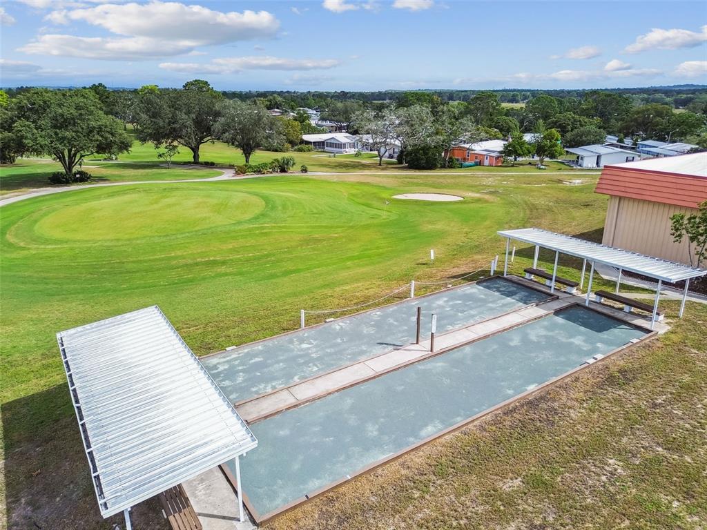 14242 Action Street Brooksville, FL 34613 - Photo 47 of 60 a view of a lake with a table and chairs