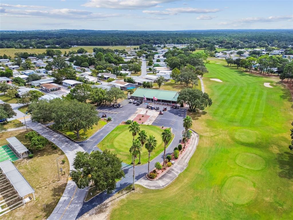14242 Action Street Brooksville, FL 34613 - Photo 52 of 60 an aerial view of residential houses with outdoor space and swimming pool