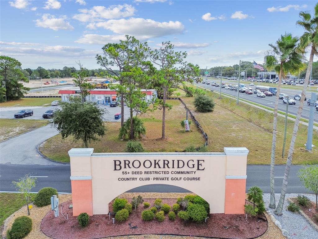 14242 Action Street Brooksville, FL 34613 - Photo 60 of 60 a sign on the side of a building