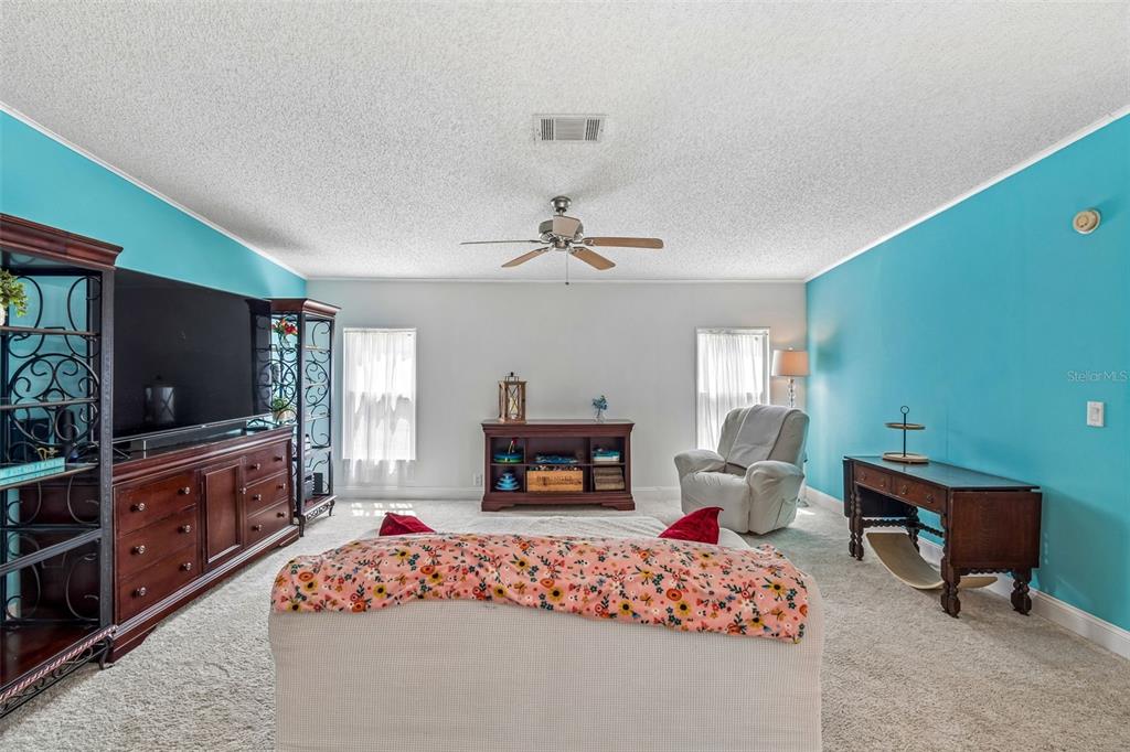 14242 Action Street Brooksville, FL 34613 - Photo 7 of 60 a living room with furniture and a flat screen tv