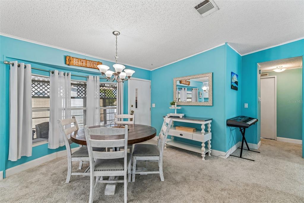 14242 Action Street Brooksville, FL 34613 - Photo 10 of 60 a dining room with furniture and window