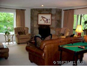 39 Hunting Country Road Tryon, NC 28782 - Photo 2 of 8 a living room with furniture and a fireplace